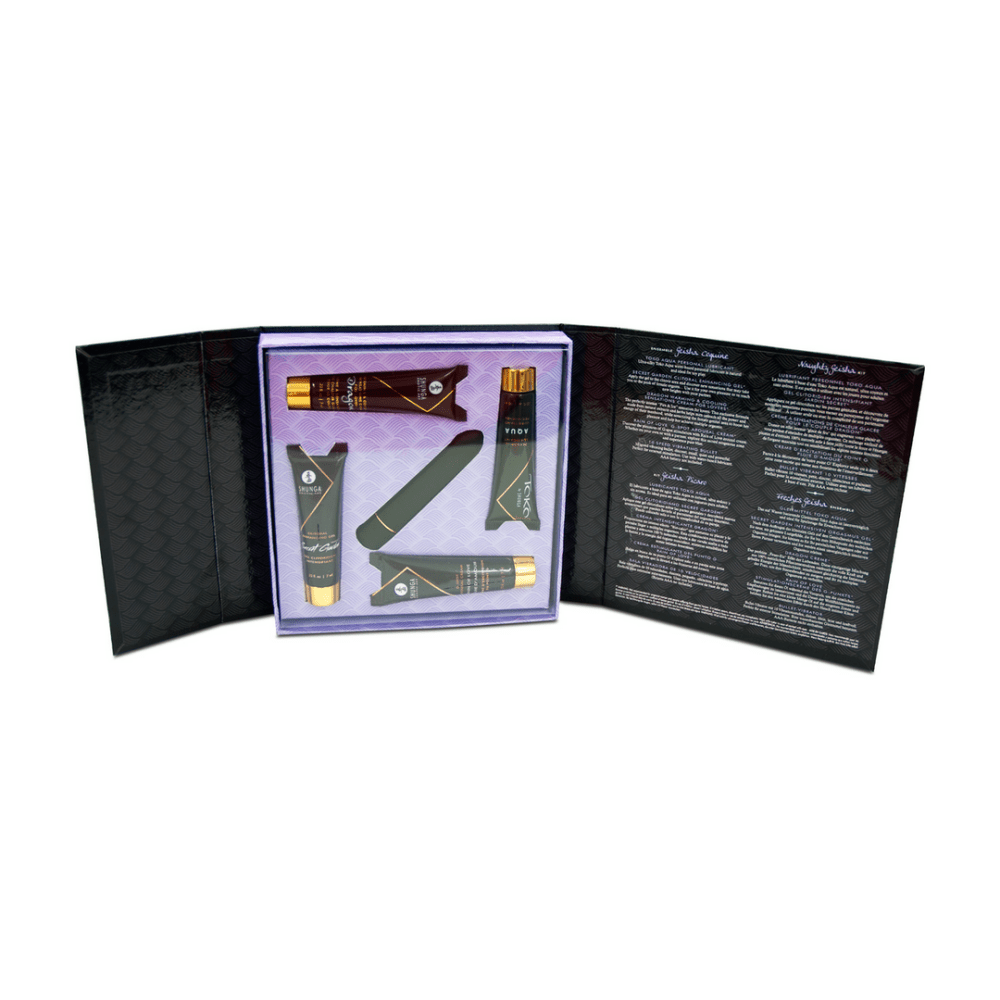 Opengeklapte Naughty Geisha Kit met de tubes en de bullet op een paarse inleg en uitlegtekst op de binnenflap