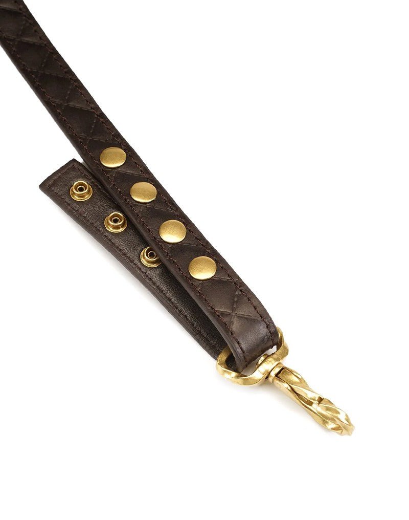 Donkere hangband met drukknopen en goudkleurige clip