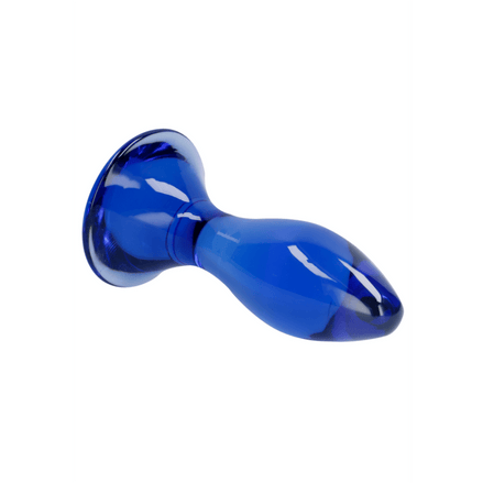 Blauwe glazen butt plug Follower van Chrystalino by Shots, liggend met afgeronde top en brede basis.