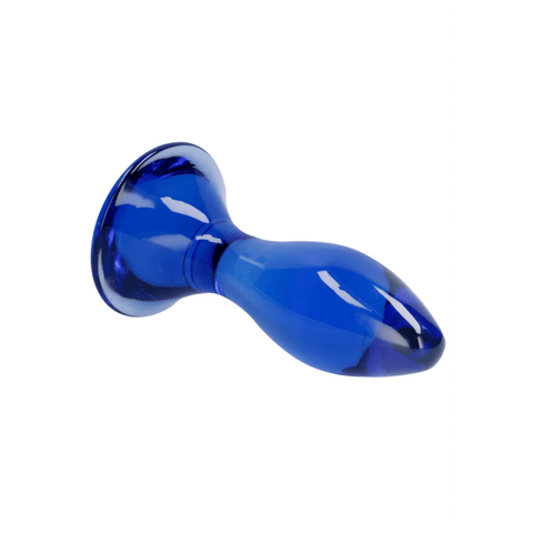 Blauwe glazen butt plug Follower van Chrystalino by Shots, liggend met afgeronde top en brede basis.