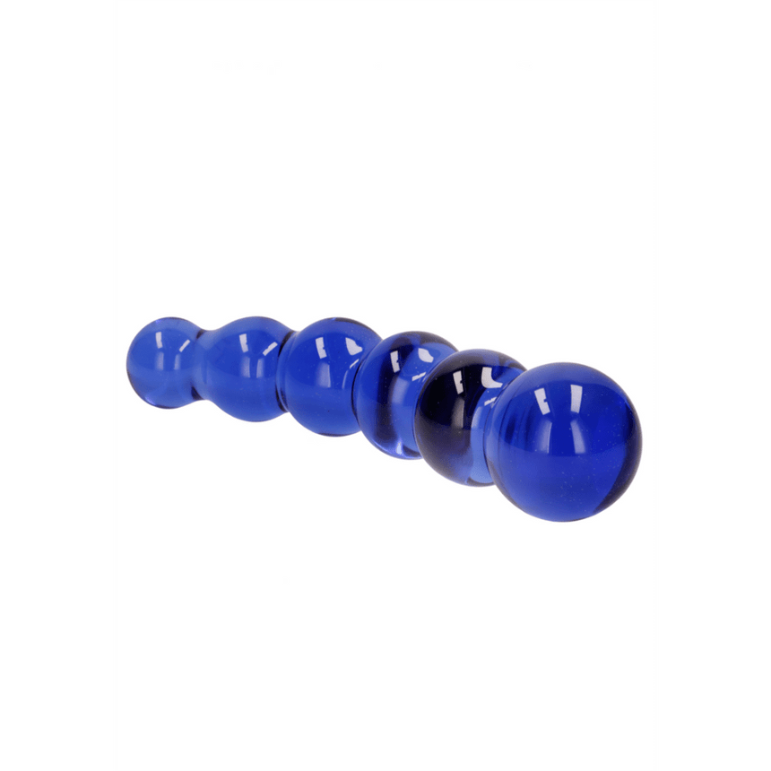 Blauwe Chrystalino glazen dildo Planeten, liggend op witte achtergrond met oplopende ronde vormen.