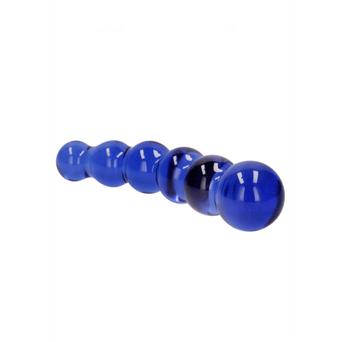 Blauwe Chrystalino glazen dildo Planeten, liggend op witte achtergrond met oplopende ronde vormen.