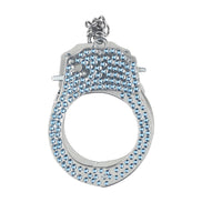 Close-up van de Ouch! Diamond Handboeien in blauw met zichtbaar vergrendelmechanisme en sleutel