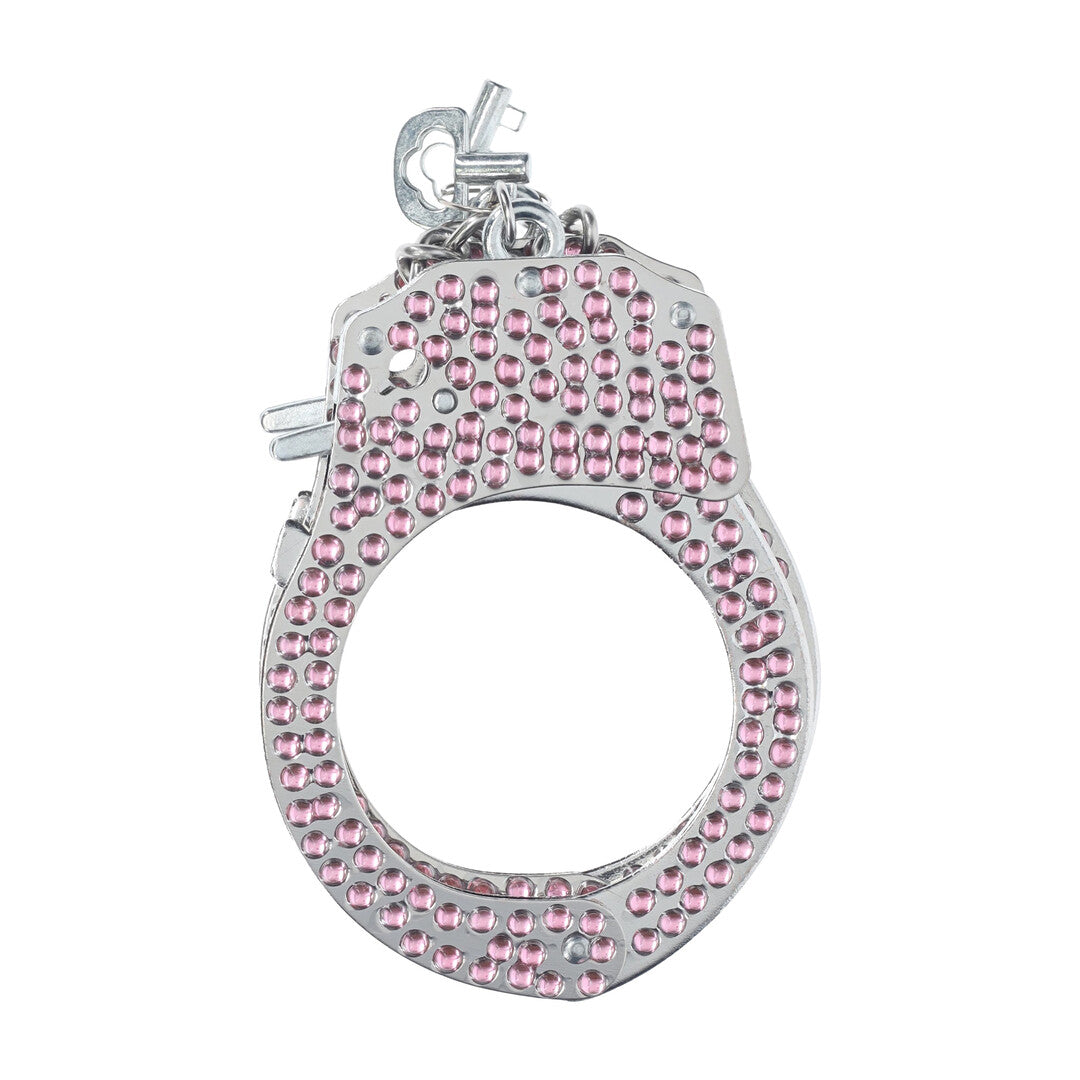Close-up van de Ouch! Diamond Handboeien in roze met zichtbaar vergrendelmechanisme en sleutel