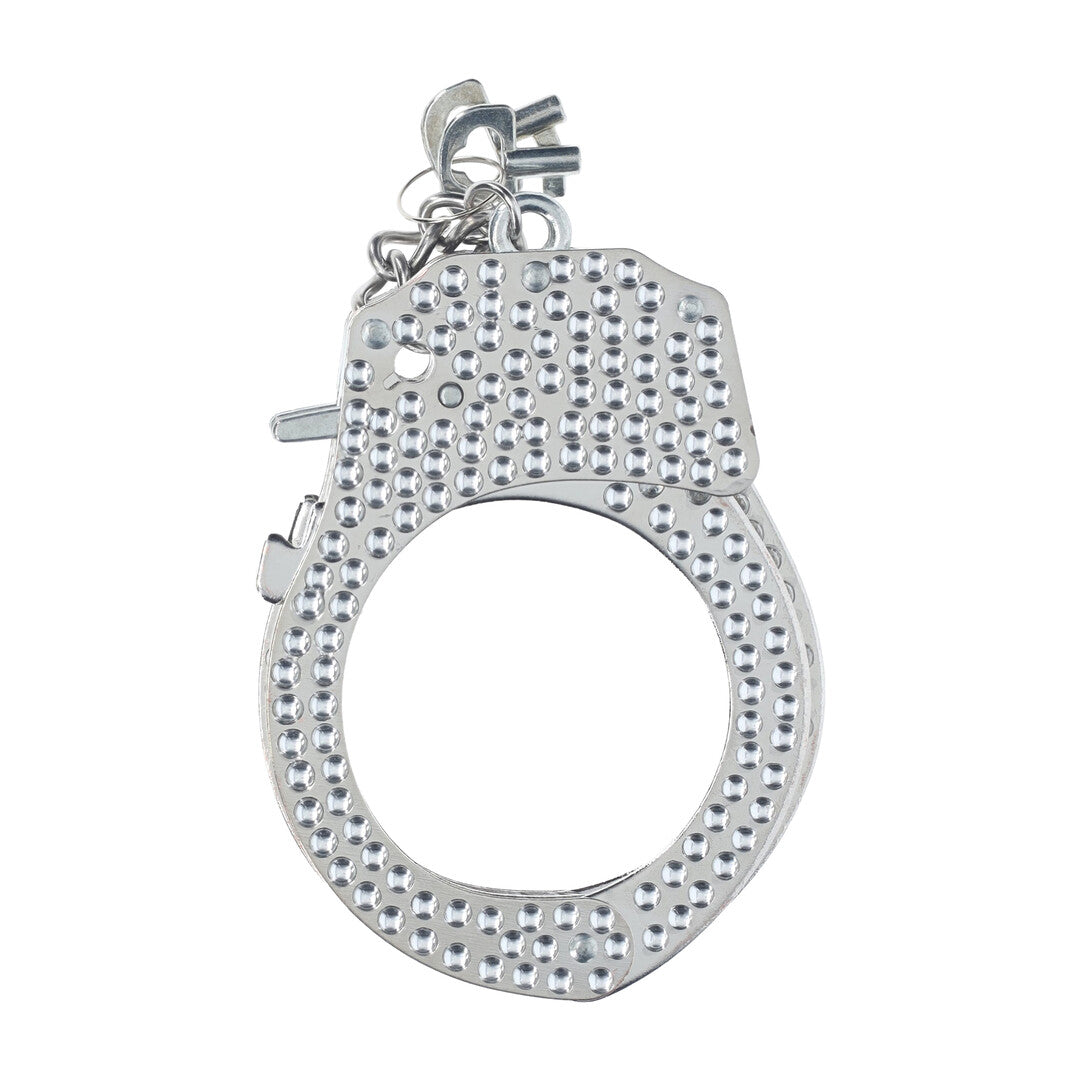 Close-up van de Ouch! Diamond Handboeien in zilver met zichtbaar vergrendelmechanisme en sleutel