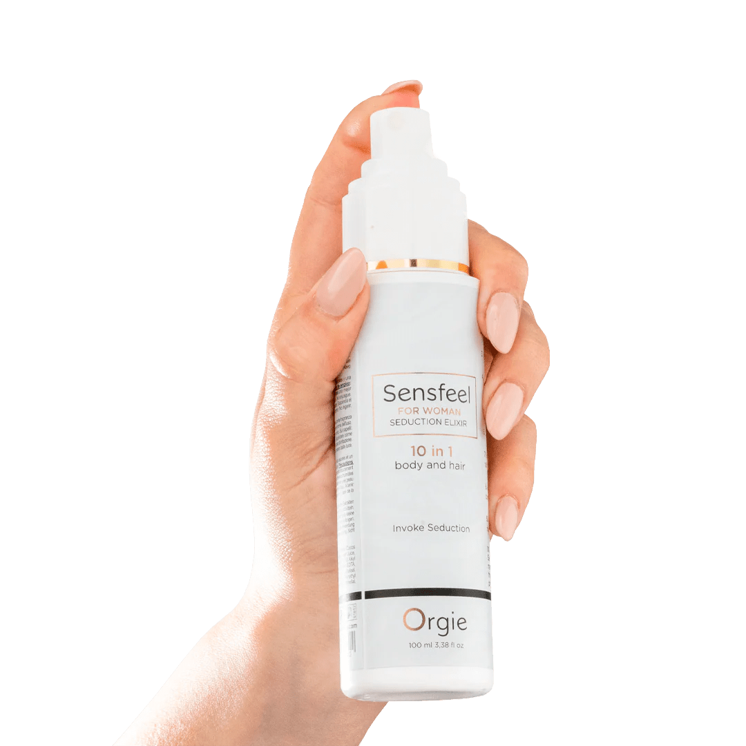 Hand met Orgie Sensfeel fles – haar- en lichaamsemulsie met feromonen 100 ml