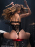 Mapalé Rock Star wetlook bodysuit zwart in maat S/M, lifestyle donker, achteraanzicht met glans, bandjes en laarzen