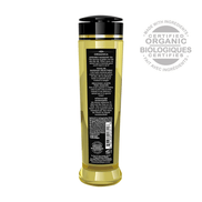 Shunga Organica massageolie groene thee, 240 ml, close-up van de fles met gouden label op witte achtergrond