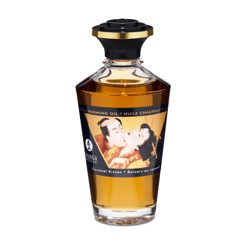 Shunga Aphrodisia Olie Caramel Kisses 100 ml in sierlijke amberkleurige fles met zwarte dop