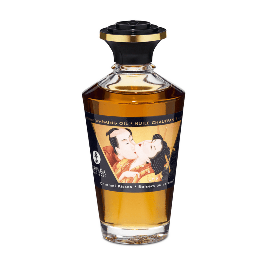 Shunga Aphrodisia Olie Caramel Kisses 100 ml in sierlijke amberkleurige fles met zwarte dop
