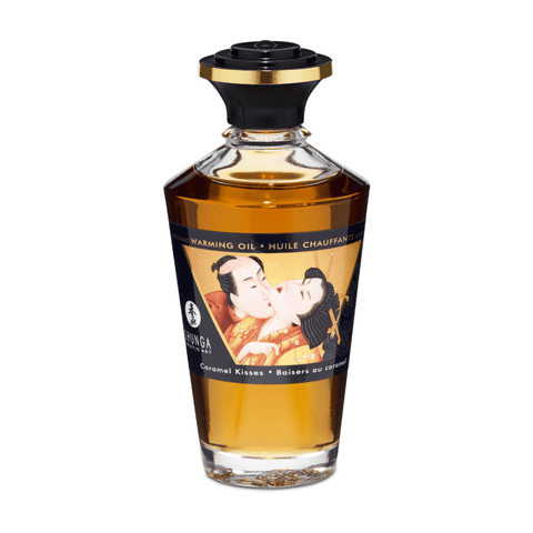 Shunga Aphrodisia Olie Caramel Kisses 100 ml in sierlijke amberkleurige fles met zwarte dop