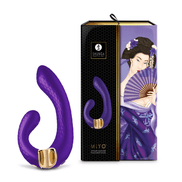 Shunga MIYO G-Spot vibrator in diepe paarstint naast luxe paars-gouden verpakking voor stijlvolle premium presentatie