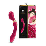 Shunga ZOA framboos clitoris vibrator naast luxe zwarte verpakking met roze illustraties, rechtopstaand