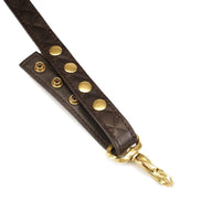 Donkere hangband met drukknopen en goudkleurige clip