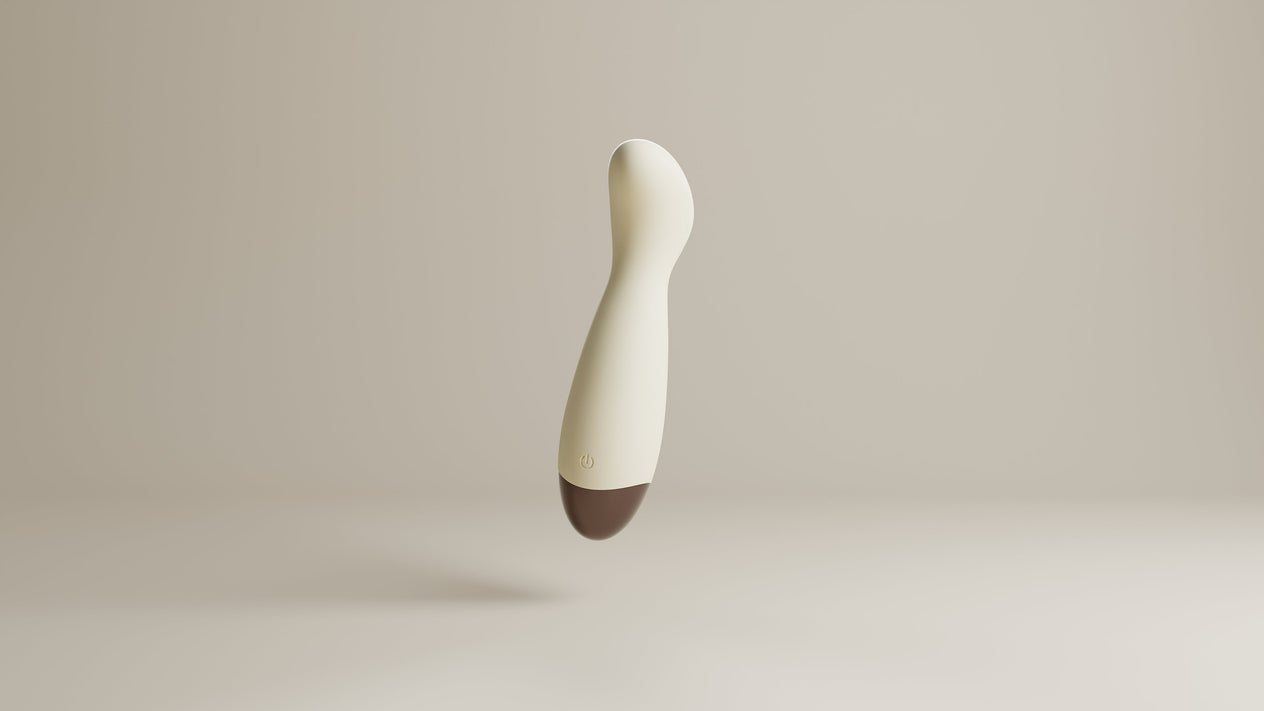 Odes Ease Mini Wand Vibrator in beige, schuin zwevend met afgeronde kop, powerknop en bruine onderzijde