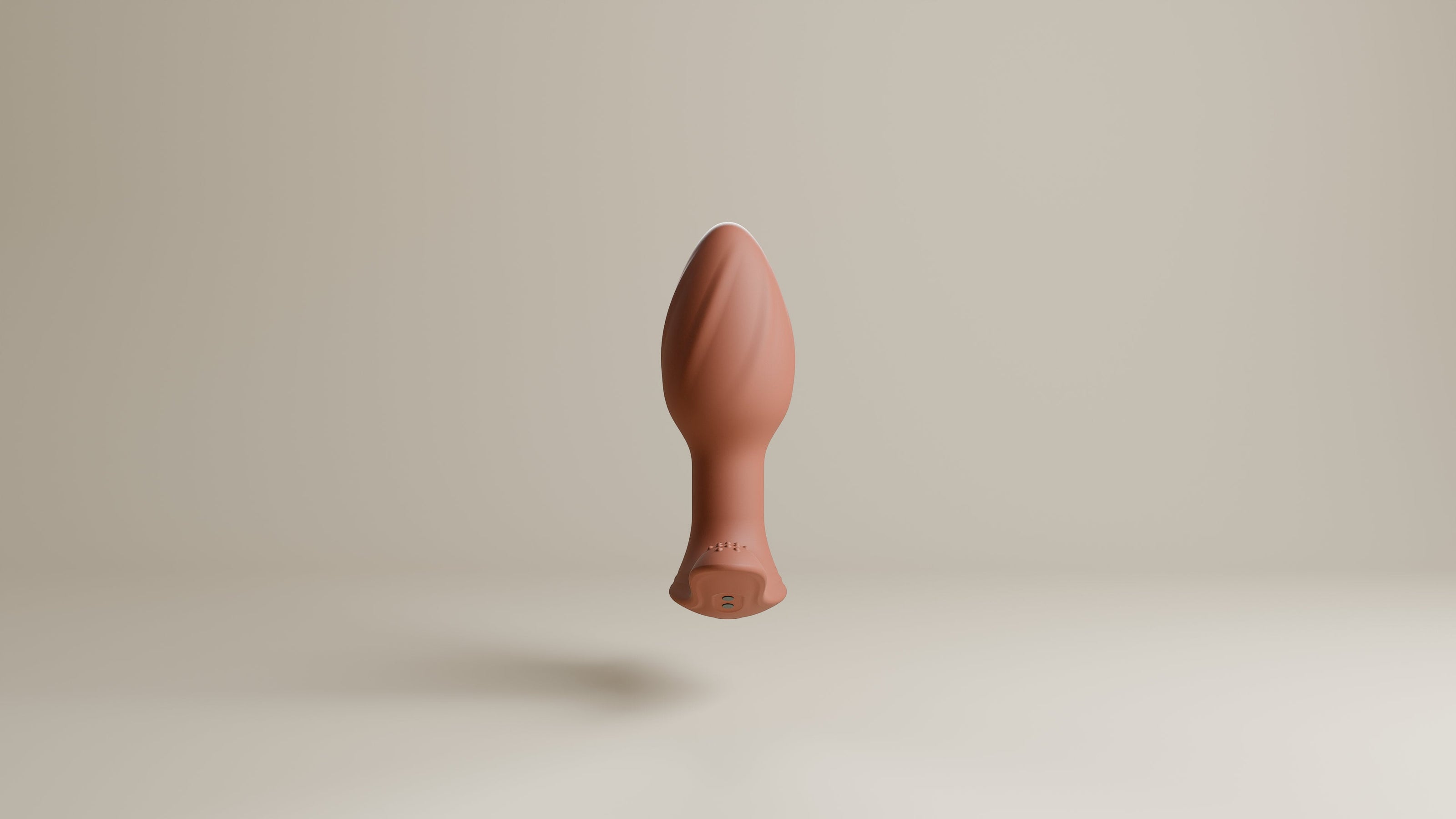 Odes Euphora buttplug in terracotta, frontaal zwevend gefotografeerd met afgeronde top en brede basis