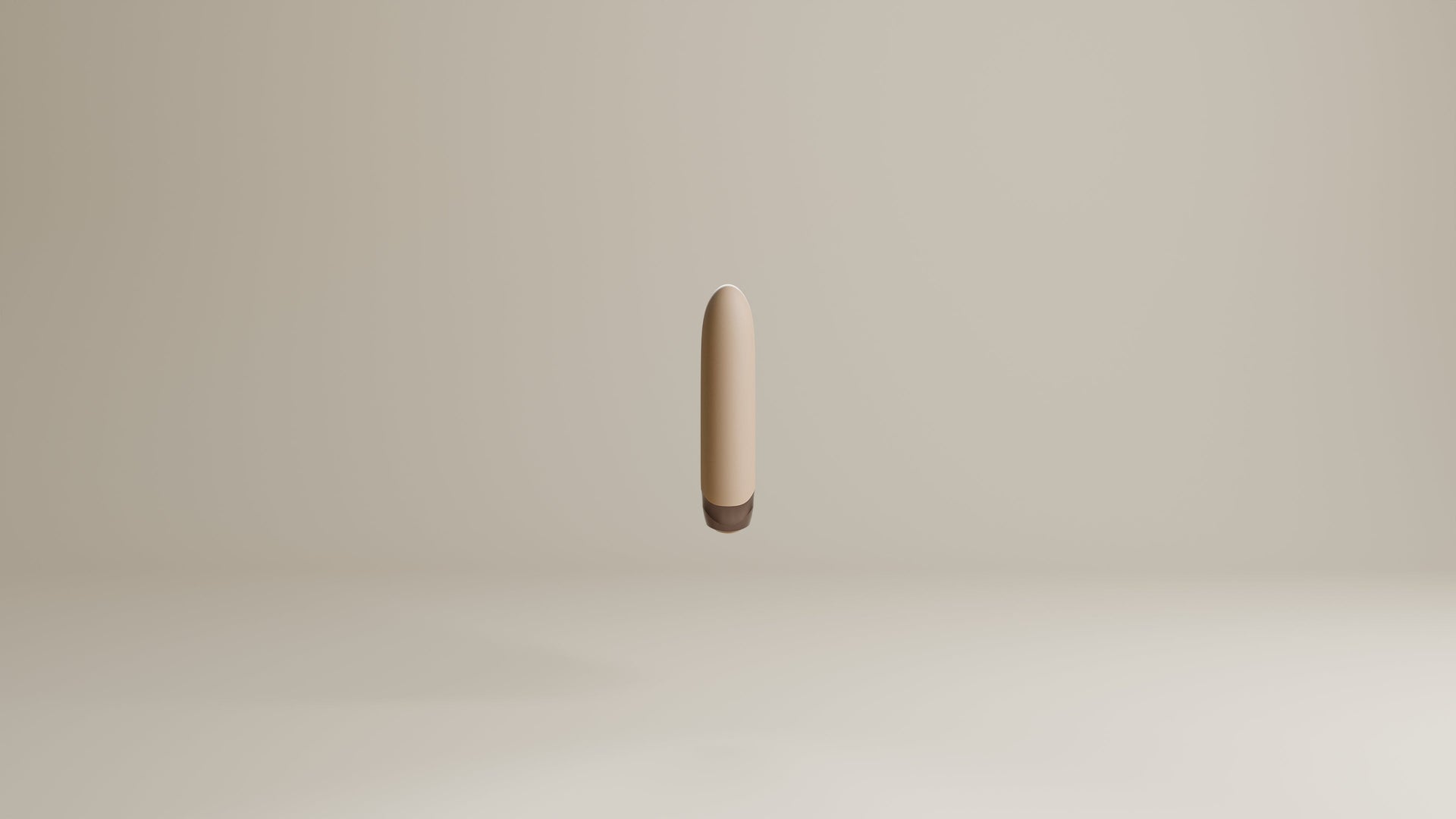 Odes Intima Mini Bullet Vibrator in beige, zwevend frontaal gefotografeerd met donker afgerond uiteinde