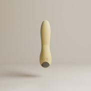 Odes Sense wand vibrator in beige vanuit zijaanzicht, met smalle tip, zwarte accentband en gebogen vorm