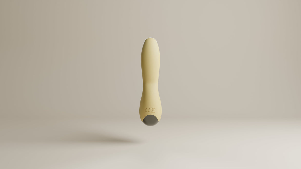 Odes Sense wand vibrator in beige vanuit zijaanzicht, met smalle tip, zwarte accentband en gebogen vorm
