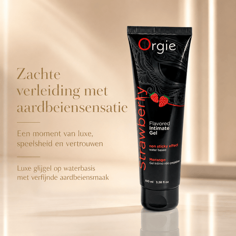 Orgie Strawberry glijgel op waterbasis in zwarte tube, luxe beige campagnebeeld met aardbeiensmaak