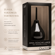 Ouch! by Shots Anale Douche Groot in zwarte verpakking met venster op een beige wellnessachtergrond.