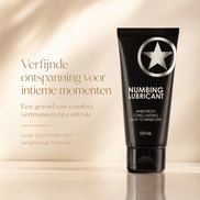Ouch! zwarte Numbing Lubricant tube in luxe beige campagnebeeld voor comfort en ontspanning bij intieme momenten